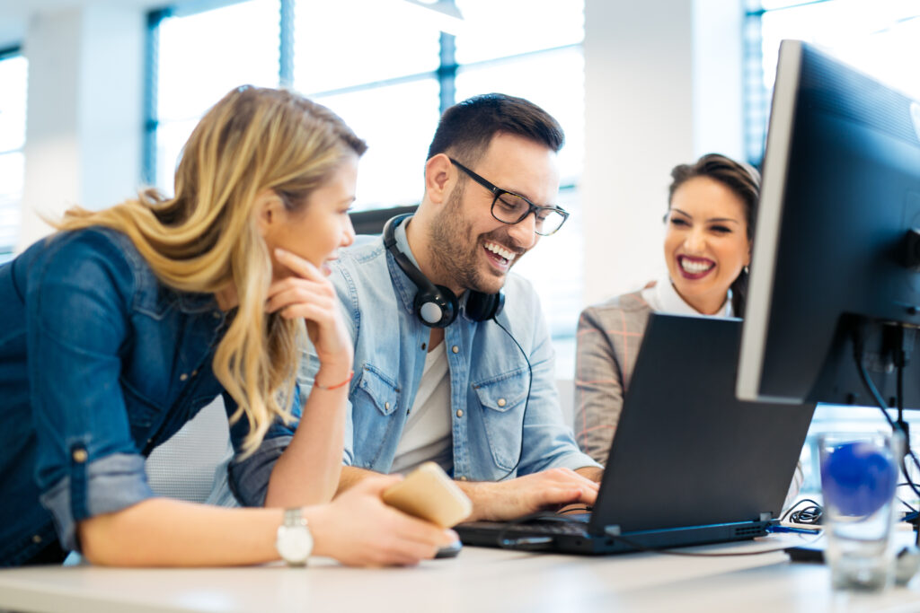 Group of business people and software developers working as a team in office